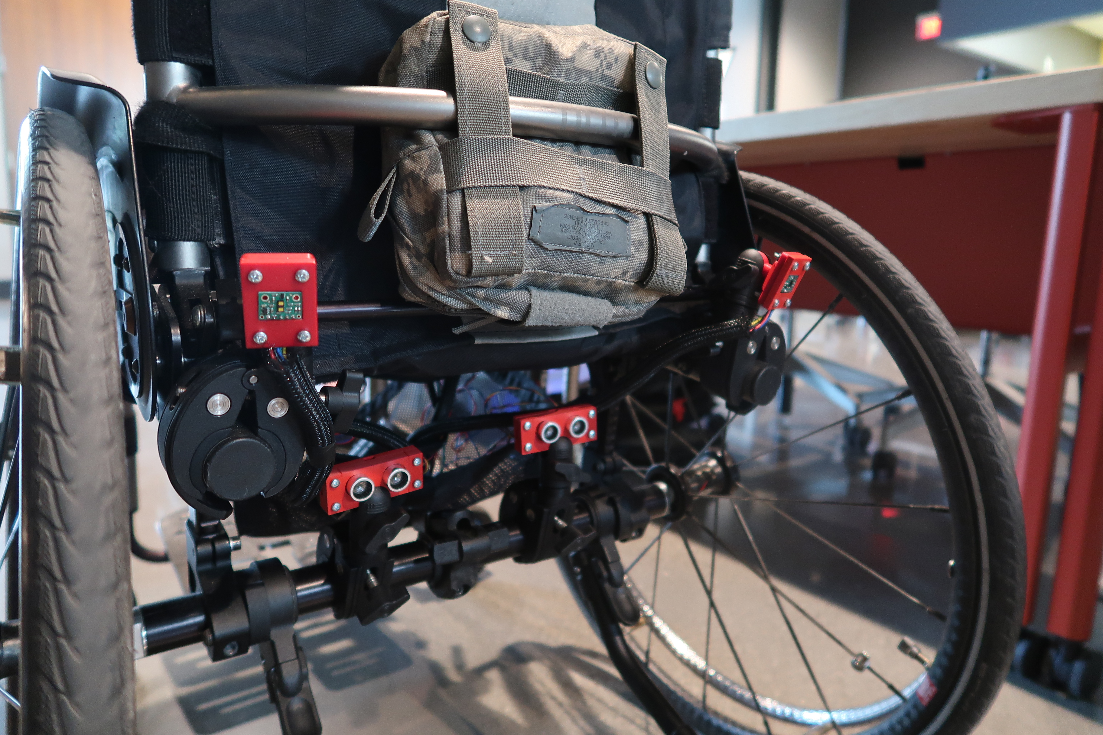 Image of the wheelchair blindspot detection system prototype mounted to Hayden's wheelchair